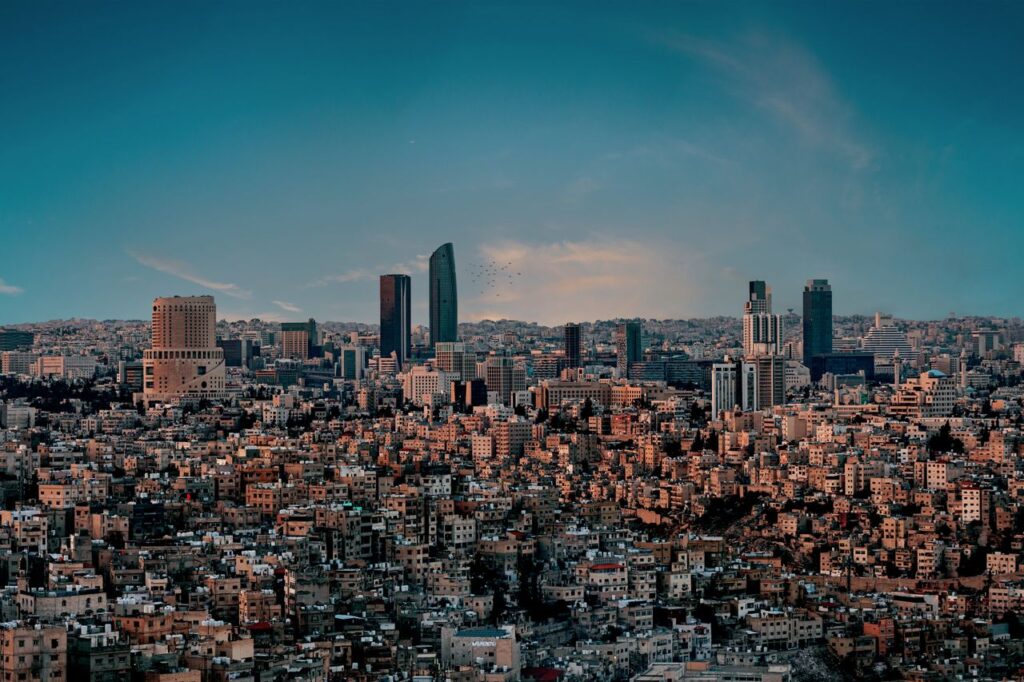 Stunning view of Amman's skyline with a vibrant cityscape at twilight.